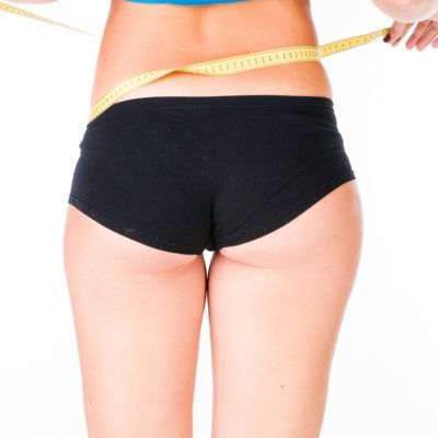 Woman diet concept with measuring tape