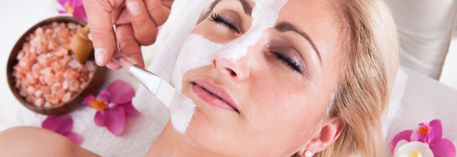 Cosmetician Applying Facial Mask or chemical peel